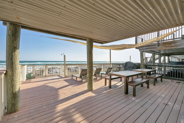 Beach level deck, lounge chairs, dining tables and more seating!