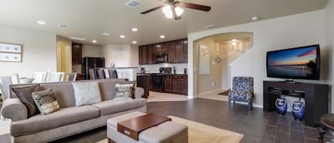 Beautiful open-format family room, dining and kitchen.