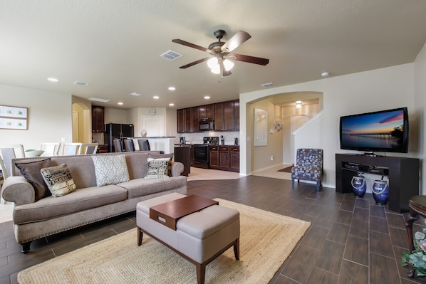 Beautiful open-format family room, dining and kitchen.