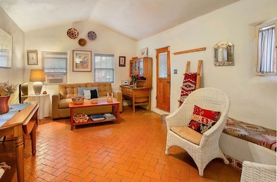 La Perla living room with red brick floors 
