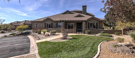 Front of home next to the clubhouse and entrance with close parking.