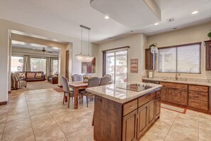 Large open concept kitchen, leading to comfortable living area.