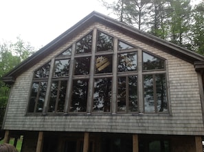 Front of cottage is all glass