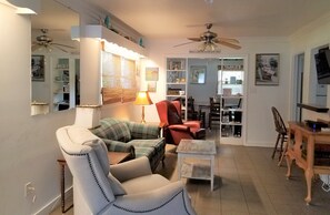 Front Room Entry. WiFi modem to on right.  Love seat, wing back chair & recliner