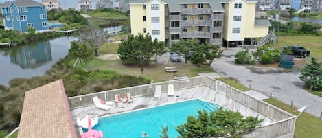 Large pool with seating in sun or shade.