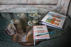 The sofa table in the Living room with our information book and guest book.