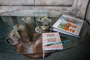 The sofa table in the Living room with our information book and guest book.