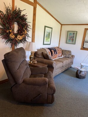 Livingroom with Sofabed and Recliner to relax and enjoy the view out the window.