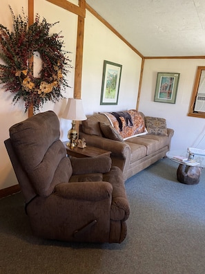 Livingroom with Sofabed and Recliner to relax and enjoy the view out the window.
