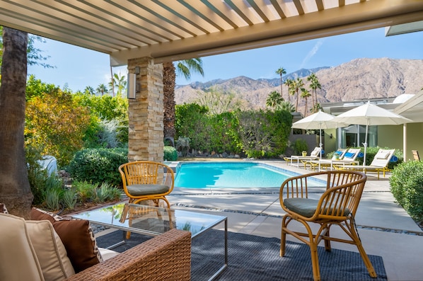 Outdoor Living Room looking West toward mountains and pool. 