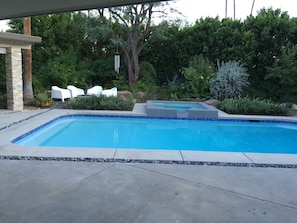 Beautiful heated pool area with hot-tub and fire-pit. Extensive gardens.