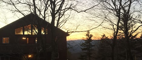 View of the house at sunset from West Ridge Road.