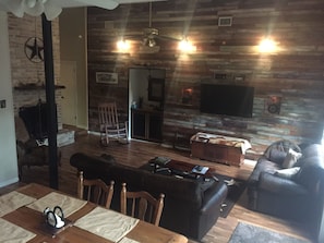 Family room with rustic wood wall