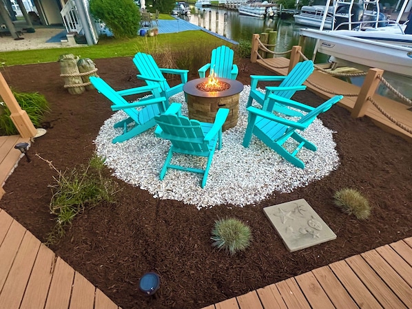 The gas fire-pit on the canal! 6 Adirondack chairs.
