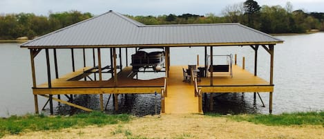 Large Private Dock with swimming, eating area, lounging area.