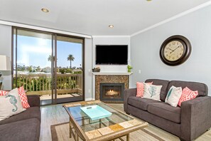 Cozy living room with easy access to East facing balcony!