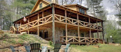 Enjoy 3 levels of this spacious Cabin & 3 Fireplaces -View from Backyard