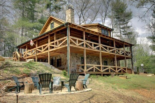 Enjoy 3 levels of this spacious Cabin & 3 Fireplaces -View from Backyard