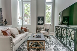Living room - 65 inch TV, Couch has a queen sleeper sofa