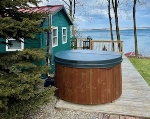 luxurious wood-fired hot tub. Steps to enter are on the side not pictured here.