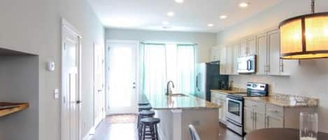 Open Kitchen with Island, Kitchen Table and 4 Stools 