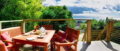 View of the sea from front decking.  Seating has been replaced by the metal set.