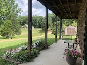 The front porch as a griddle for cooking, a table, a swing & a beautiful view!