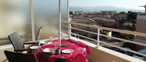 Dine in style on the balcony with fabulous views of Nice, the Med. and the Alps.