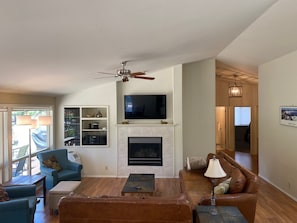 Living room with hallway to all bedrooms, bathrooms, laundry room, garage