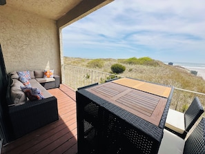 Sectional sofa and dining table off family room with direct oceanfront views!