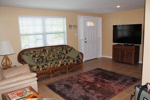 Living room with 60 inch flat screen TV
 