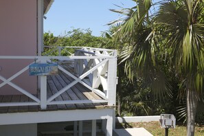 Sunning deck and charcoal grill, outside shower located on the sunning deck