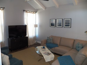 Large sectional, comfy armchairs and 55" Smart TV under 12" vaulted ceilings