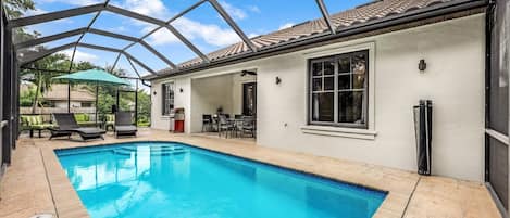 Private, screened-in and heated pool area