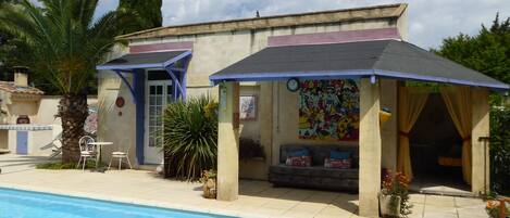 Looking towards the pool studio. double doors into Kitchen