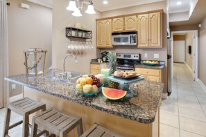 Kitchen with large pantry and free-standing ice maker. 