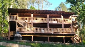 Back yard of the house 2 covered decks and Fire pit overlooking the cove.