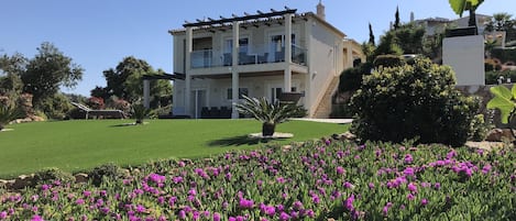 Large gardens surround the villa