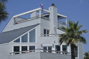 Exterior of the home showcasing the 3 decks.