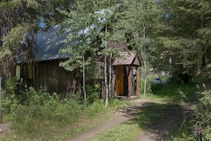 This lovely cabin in the woods is set for your relaxation.