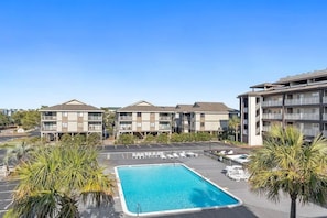 Pool with tables, chairs, lounge chairs, umbrellas. Never Crowded, new decking