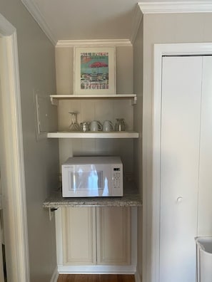 The home has a microwave and a mini fridge