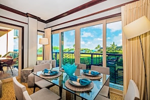H205_Living room. Italian designer's dining table set with ocean view.