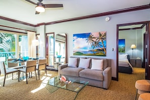 H205_Spacious living room with queen size platform sleeping sofa and art