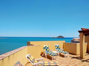 Sunny roof terrace overlooking the Mediterranean sea