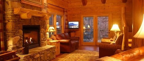 The Great Room 25-foot ceiling and massive stone fireplace.