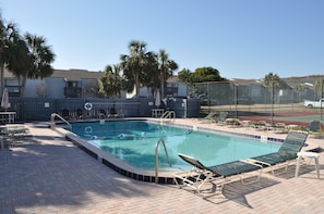 Community pool located 10 feet out back door.