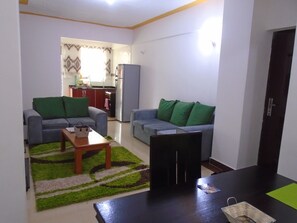 living room with open kitchen plan.