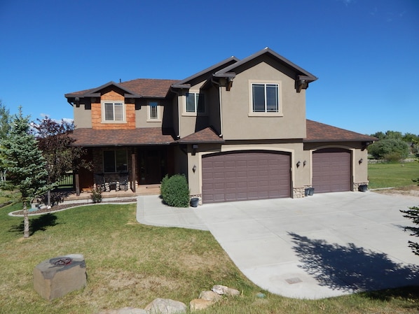 1/3 acre with large flat grass area to play games. Rocking chairs on the porch.