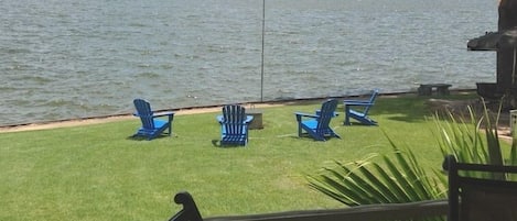 Beautiful view of Cedar Creek Lake from the back porch! Fire pit by the water.